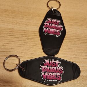 Black Keychain with Pink 'Just Taurus Vibes' Design